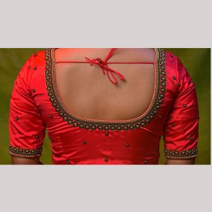 Ravishing red blouse with gold and green embroidery