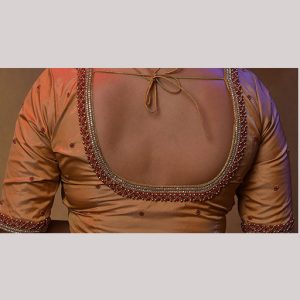 Artistic ivary blouse with contrast red bead embroidery