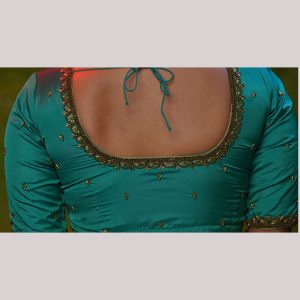 Luminous blue blouse with antique embroidery
