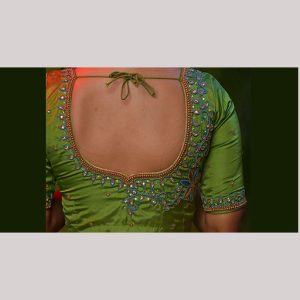 Chromatic green blouse with kundan work & contrast blue thread embroidery
