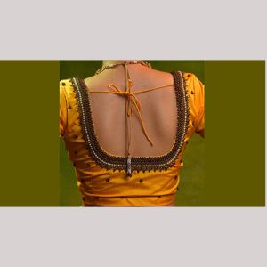 Golden yellow blouse with antique & kundan work embroidery