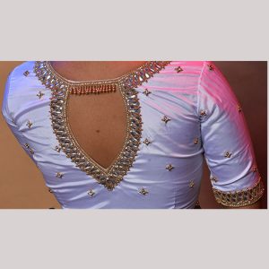 Graceful pure white blouse with gold embroidery